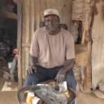 makhtar at his motorbike taxi repair workshop (1)