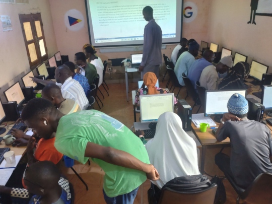 teaching computer skills at the diapalante community education centre