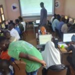 teaching computer skills at the diapalante community education centre